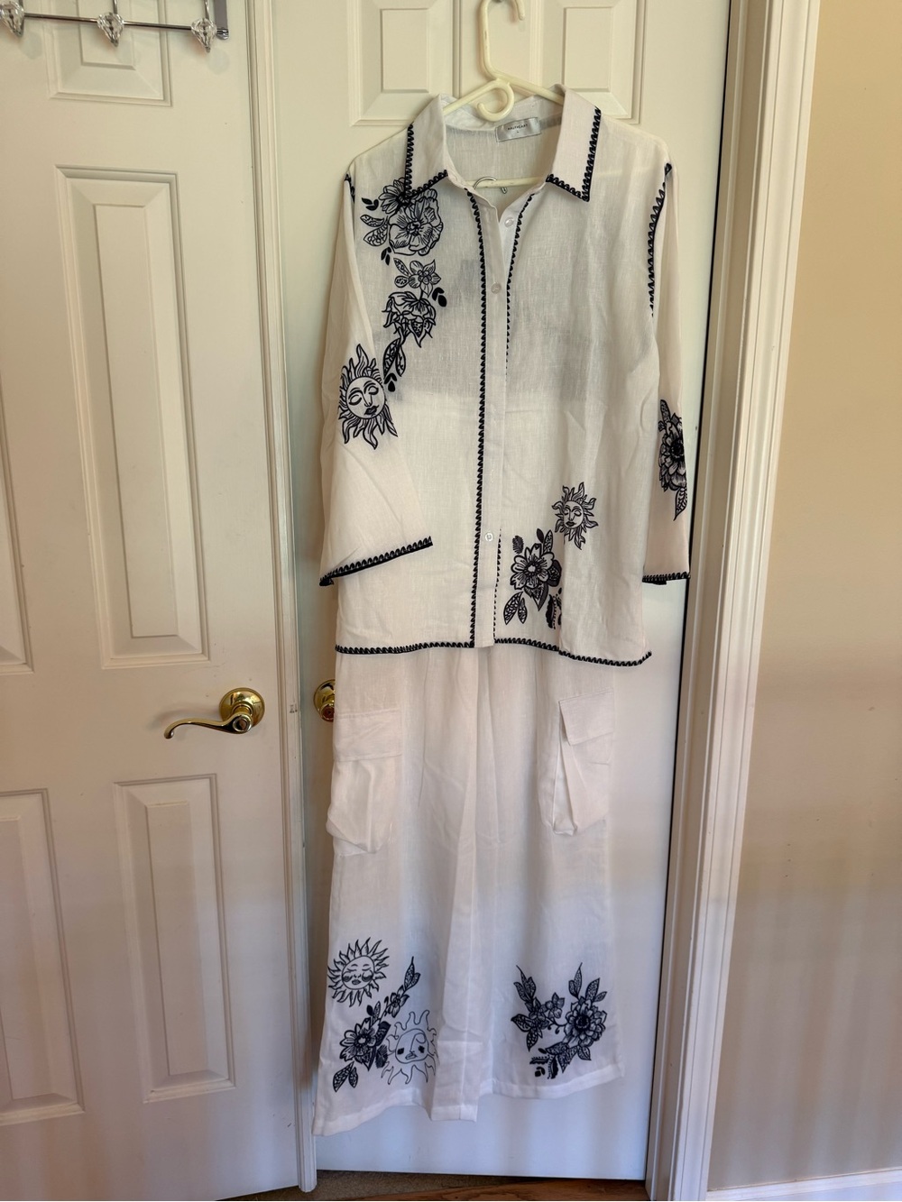 White Embroidered Two-Piece Pantsuit - Black Floral/ Sun Motif